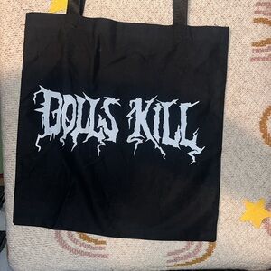 Black/white print dolls kill reusable canvas tote bag